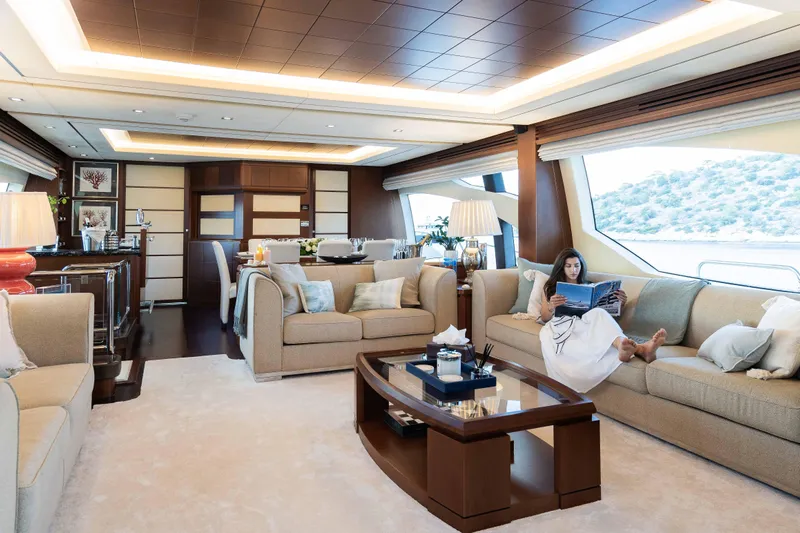 Koukles Yacht Photos Pics Luxurious interior of 2008 Azimut 95 E yacht with elegant seating and scenic views.