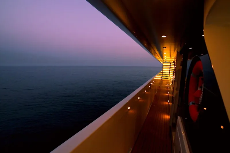 Elada Yacht Photos Pics Luxurious Bilgin 147 yacht deck at sunset, 2014 model, overlooking serene ocean.