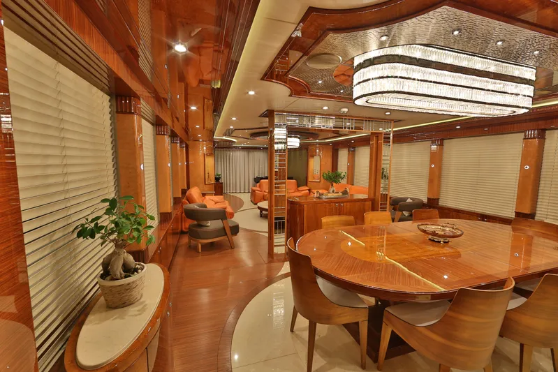 Elada Yacht Photos Pics Luxurious interior of 2014 Bilgin 147 yacht with elegant wood finishes and modern furnishings.