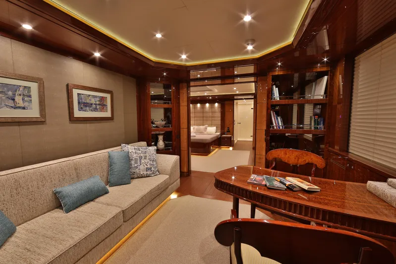 Elada Yacht Photos Pics Luxurious interior of 2014 Bilgin 147 yacht with elegant wood finishes and cozy seating.
