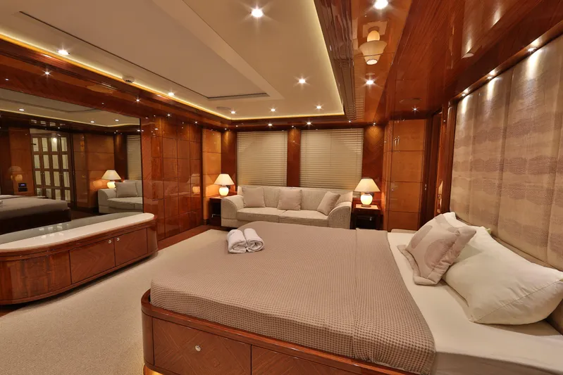 Elada Yacht Photos Pics Luxurious Bilgin 147 yacht bedroom interior, featuring elegant wood paneling and ambient lighting, 2014 model.