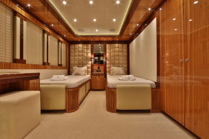 Elada Yacht Photos Pics Luxurious Bilgin 147 yacht cabin interior with twin beds, wood paneling, and ambient lighting, 2014 model.