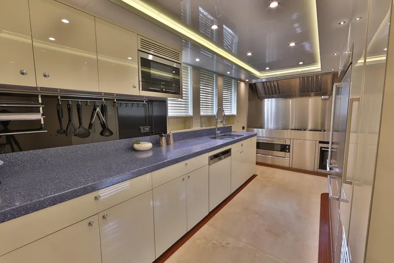 Elada Yacht Photos Pics Luxurious modern kitchen interior on Bilgin 147 yacht, featuring sleek countertops and stainless steel appliances.