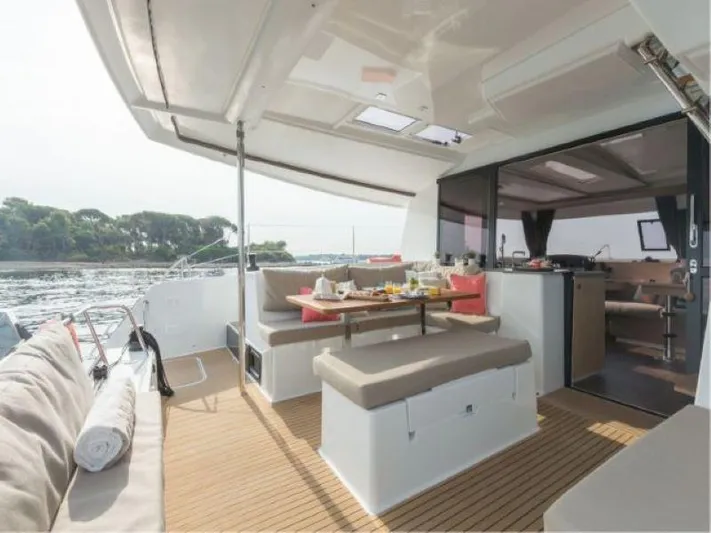 Knot On Call Yacht Photos Pics 2018 Fountaine Pajot Helia 44 Evolution catamaran with spacious outdoor seating and dining area.