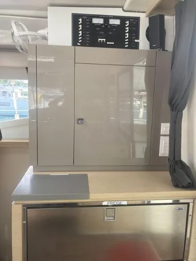 Knot On Call Yacht Photos Pics Interior of 2018 Fountaine Pajot Helia 44 Evolution yacht with control panel and storage.