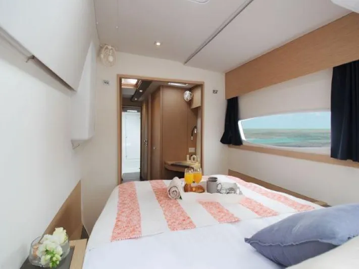 Knot On Call Yacht Photos Pics Luxurious bedroom interior of 2018 Fountaine Pajot Helia 44 Evolution catamaran.
