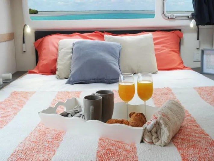 Knot On Call Yacht Photos Pics Luxurious bedroom in 2018 Fountaine Pajot Helia 44 Evolution catamaran with breakfast tray.