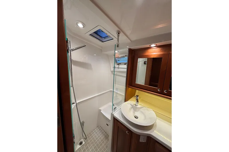 Cellibrate Yacht Photos Pics Luxurious bathroom in 2020 Sabre 45 Salon Express yacht with modern fixtures and elegant design.