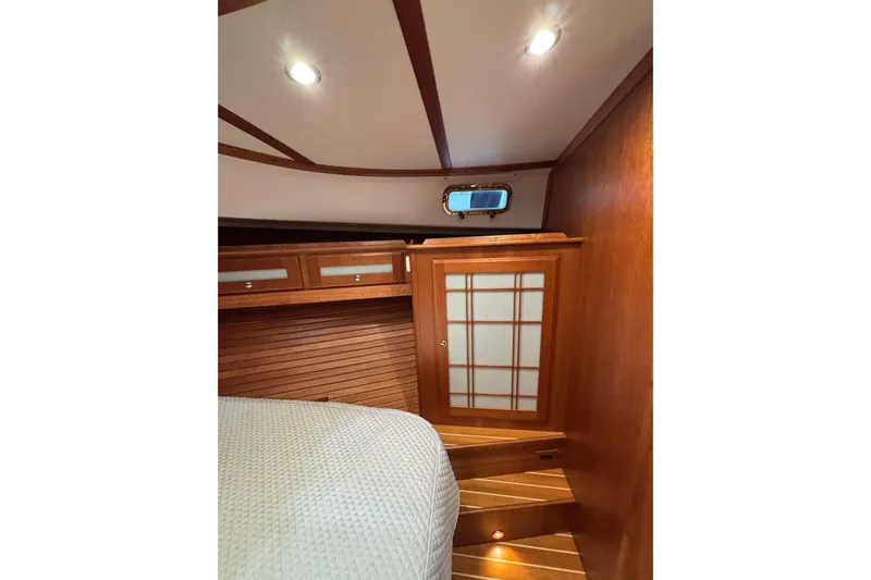 Cellibrate Yacht Photos Pics Interior of 2020 Sabre 45 Salon Express, featuring wooden cabinetry and cozy lighting.