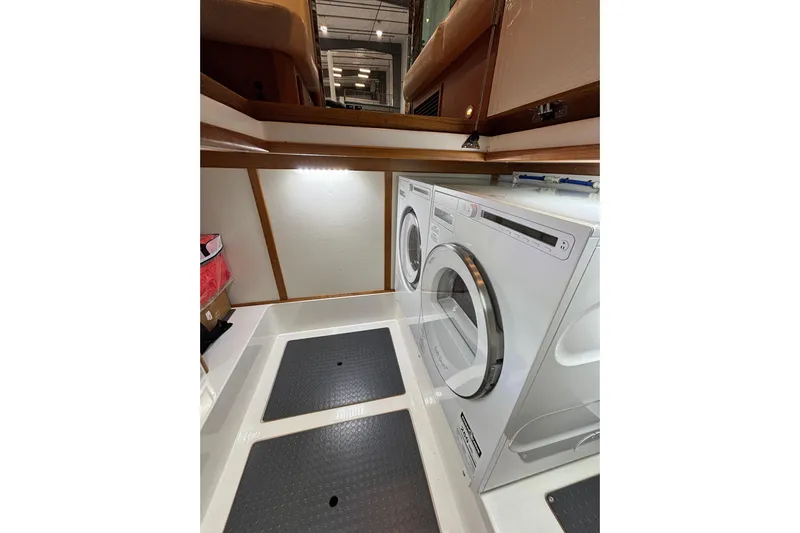 Cellibrate Yacht Photos Pics Laundry area in 2020 Sabre 45 Salon Express yacht with washer and dryer.