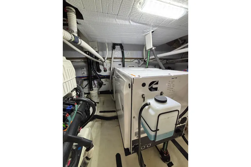 Cellibrate Yacht Photos Pics Engine room of 2020 Sabre 45 Salon Express with Cummins generator and piping.