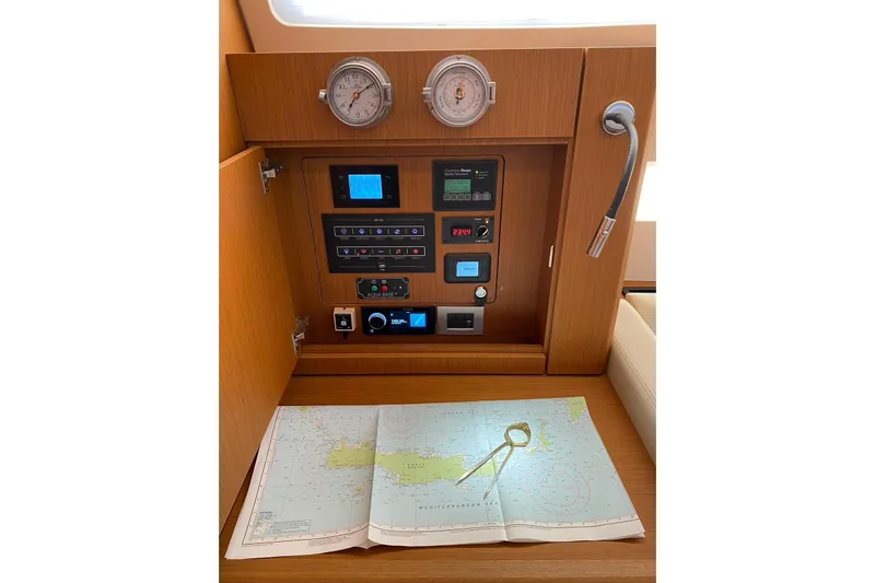 Euphoria Yacht Photos Pics Navigation station on a 2021 Jeanneau 60 yacht with map and instruments.
