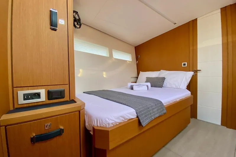 Euphoria Yacht Photos Pics Luxurious cabin interior of 2021 Jeanneau 60 yacht with cozy bed and modern design.