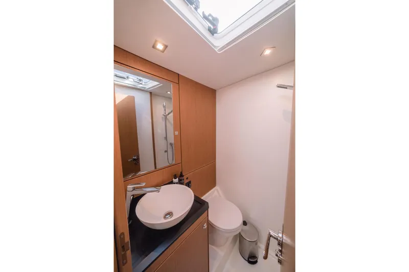 Euphoria Yacht Photos Pics Modern bathroom in 2021 Jeanneau 60 yacht with sleek fixtures and natural lighting.