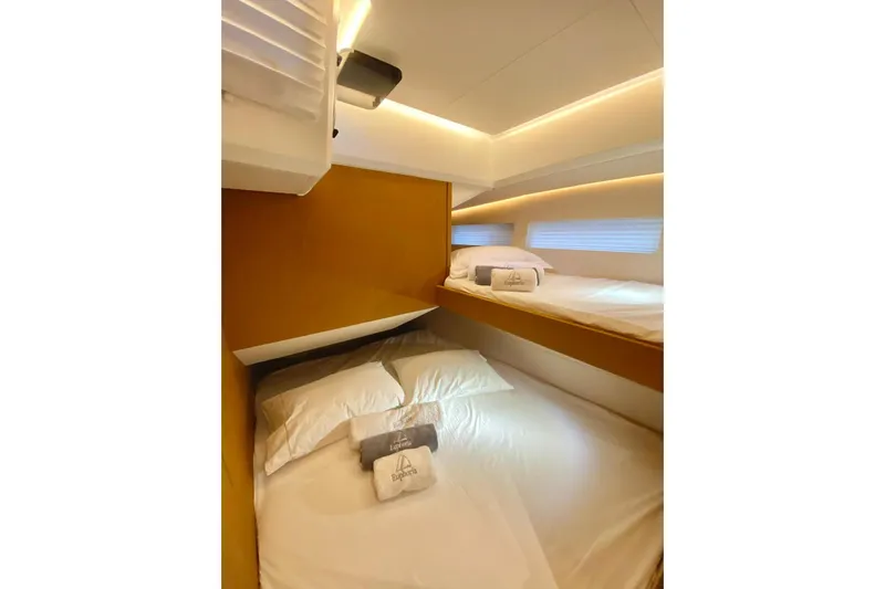 Euphoria Yacht Photos Pics Luxurious cabin interior of 2021 Jeanneau 60 yacht with cozy bedding.
