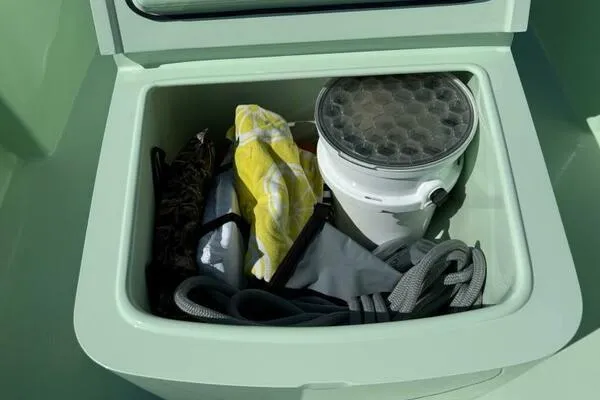 Wicked Tuna Yacht Photos Pics Storage compartment in Custom Vernese V23 boat, containing ropes and gear, 2021 model.