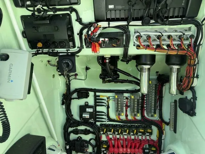 Wicked Tuna Yacht Photos Pics Electrical system of a 2021 Custom Vernese V23 boat with organized wiring and components.