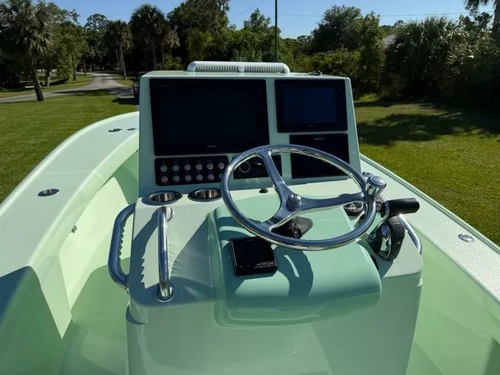 Wicked Tuna Yacht Photos Pics Custom Vernese V23 boat dashboard with steering wheel and dual screens, 2021 model.