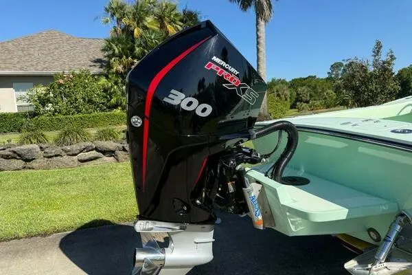 Wicked Tuna Yacht Photos Pics Outboard motor on Custom Vernese V23 boat, 2021 model, in a sunny residential setting.