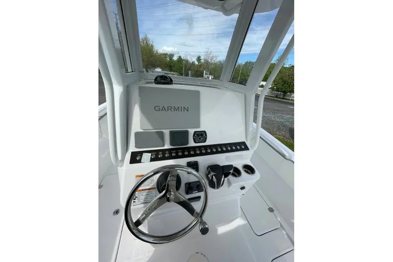 Century 2400cc Yacht Photos Pics Century 2400 Center Console 2022 boat dashboard with Garmin navigation system.