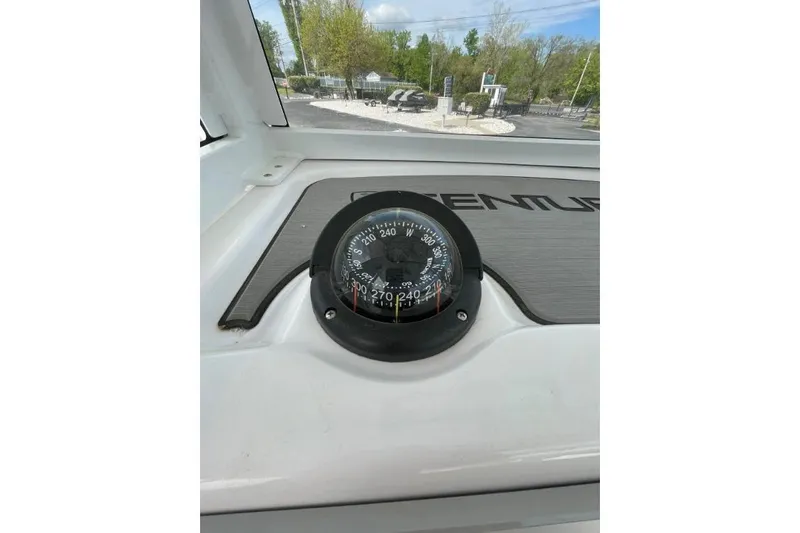 Century 2400cc Yacht Photos Pics Compass on 2022 Century 2400 Center Console boat dashboard, outdoor view.
