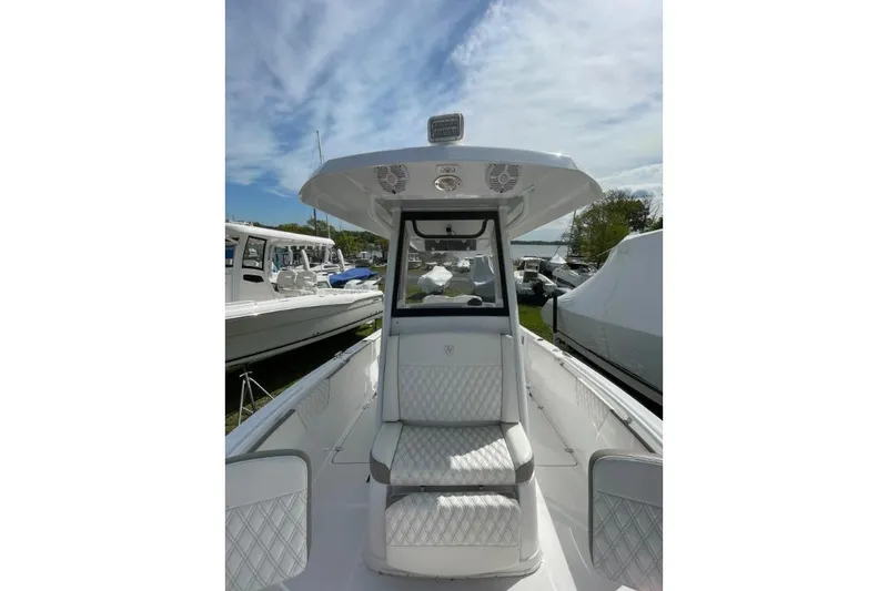 Century 2400cc Yacht Photos Pics 2022 Century 2400 Center Console boat with sleek design and comfortable seating.