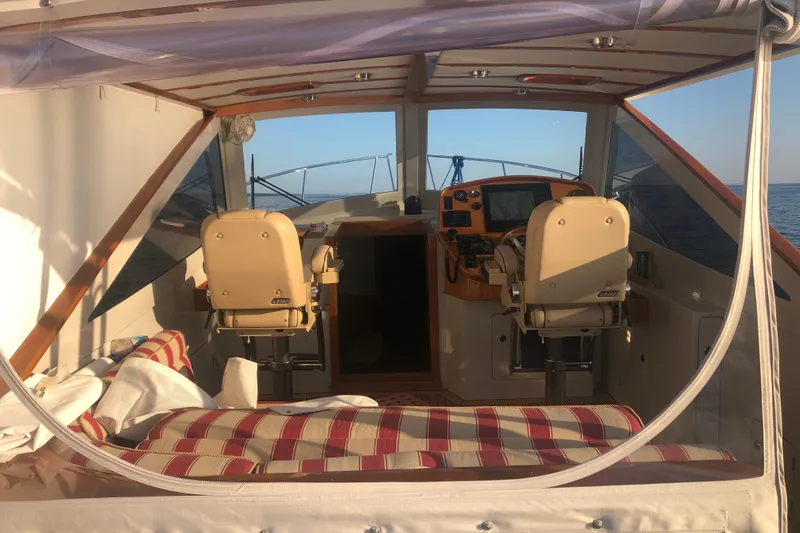 Skylark Yacht Photos Pics 2005 Lyman-Morse Monhegan yacht interior with helm, seating, and ocean view.