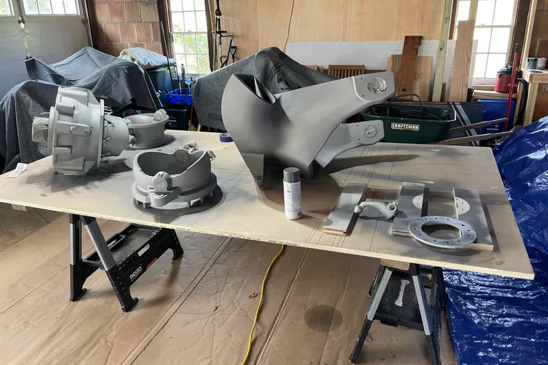 Skylark Yacht Photos Pics Boat parts from a 2005 Lyman-Morse Monhegan, displayed on a workbench in a garage.