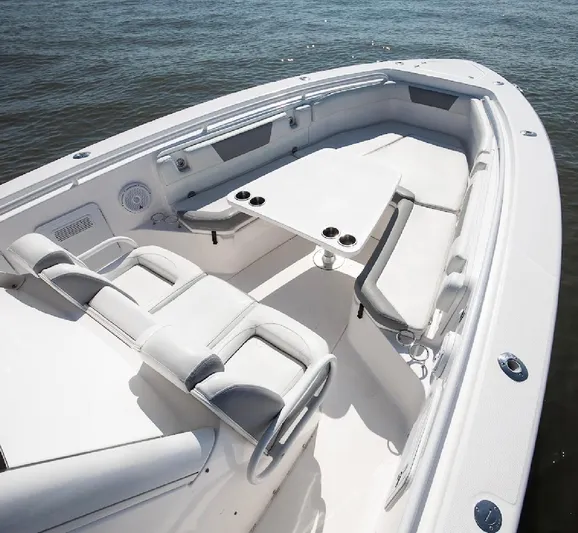 Done Diggin Yacht Photos Pics 2019 Everglades 355 Center Console boat interior with seating and table on water.