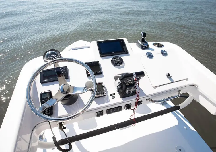 Done Diggin Yacht Photos Pics 2019 Everglades 355 Center Console helm with steering wheel and navigation controls.