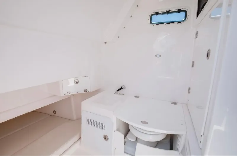 Done Diggin Yacht Photos Pics 2019 Everglades 355 Center Console boat interior with compact bathroom amenities.