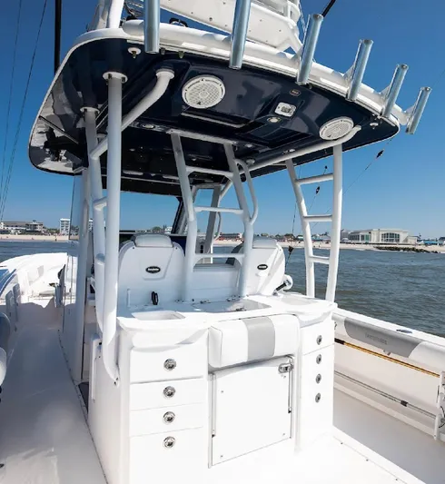 Done Diggin Yacht Photos Pics 2019 Everglades 355 Center Console boat interior with seating and storage, on the water.