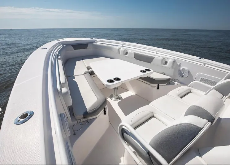 Done Diggin Yacht Photos Pics 2019 Everglades 355 Center Console boat interior with seating and table on open water.