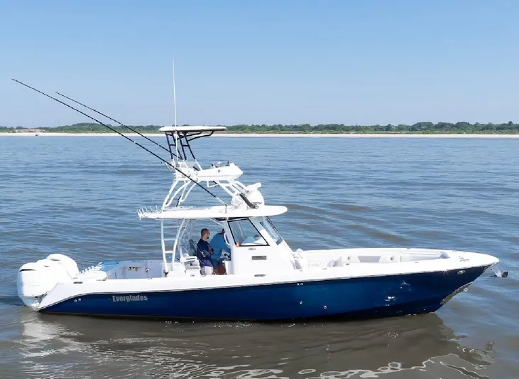 Done Diggin Yacht Photos Pics 2019 Everglades 355 Center Console boat on calm water, clear sky background.