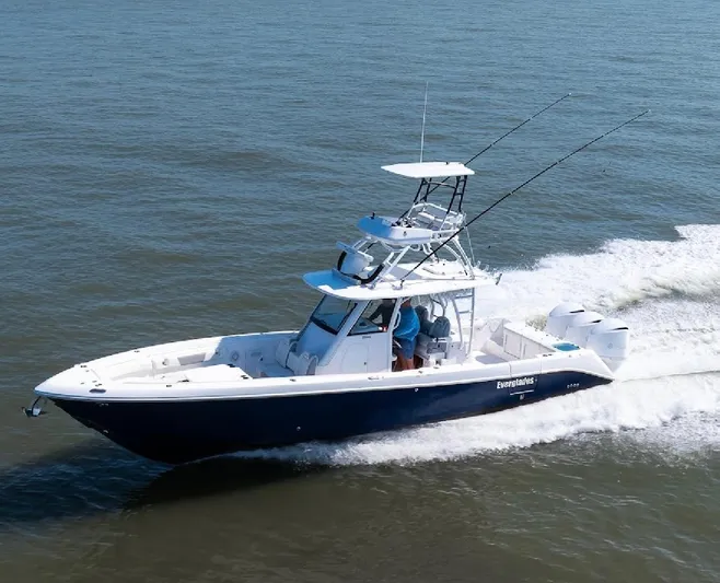 Done Diggin Yacht Photos Pics 2019 Everglades 355 Center Console boat cruising on open water.