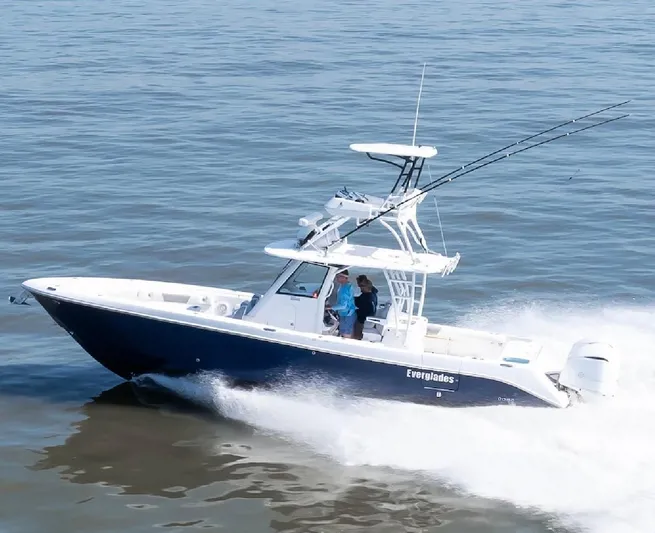 Done Diggin Yacht Photos Pics 2019 Everglades 355 Center Console boat cruising on open water.