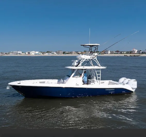 Done Diggin Yacht Photos Pics 2019 Everglades 355 Center Console boat cruising on open water.