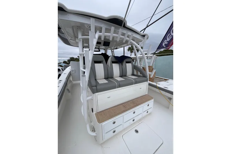  Yacht Photos Pics 2023 Regulator 41 boat seating area with storage drawers and cushioned seats.