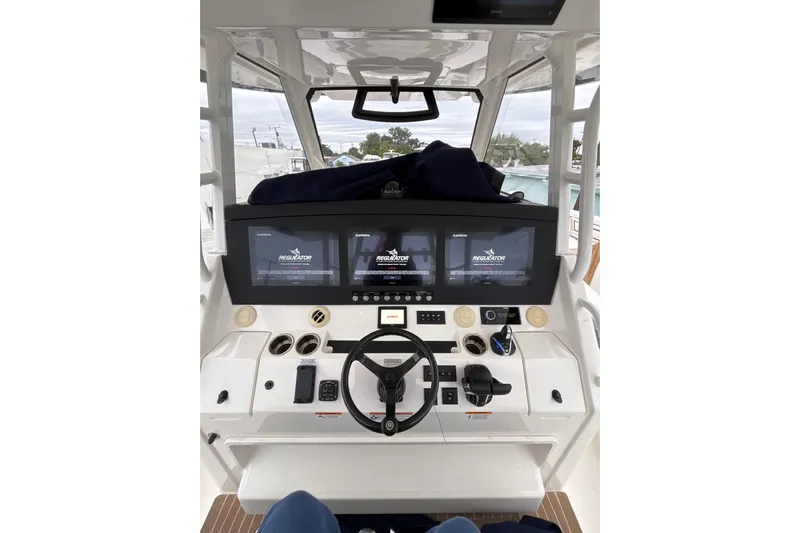  Yacht Photos Pics 2023 Regulator 41 boat helm with advanced navigation displays and controls.