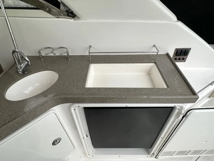 Beautify Yacht Photos Pics 2010 Regal 3760 Sportyacht kitchenette with sink and countertop.