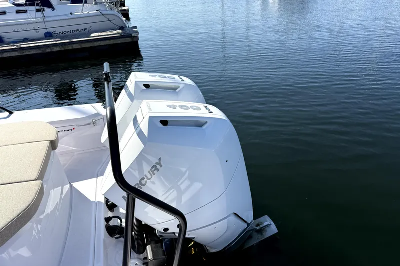  Yacht Photos Pics 2025 Axopar 37 XC CROSS CABIN with dual Mercury outboard engines docked.