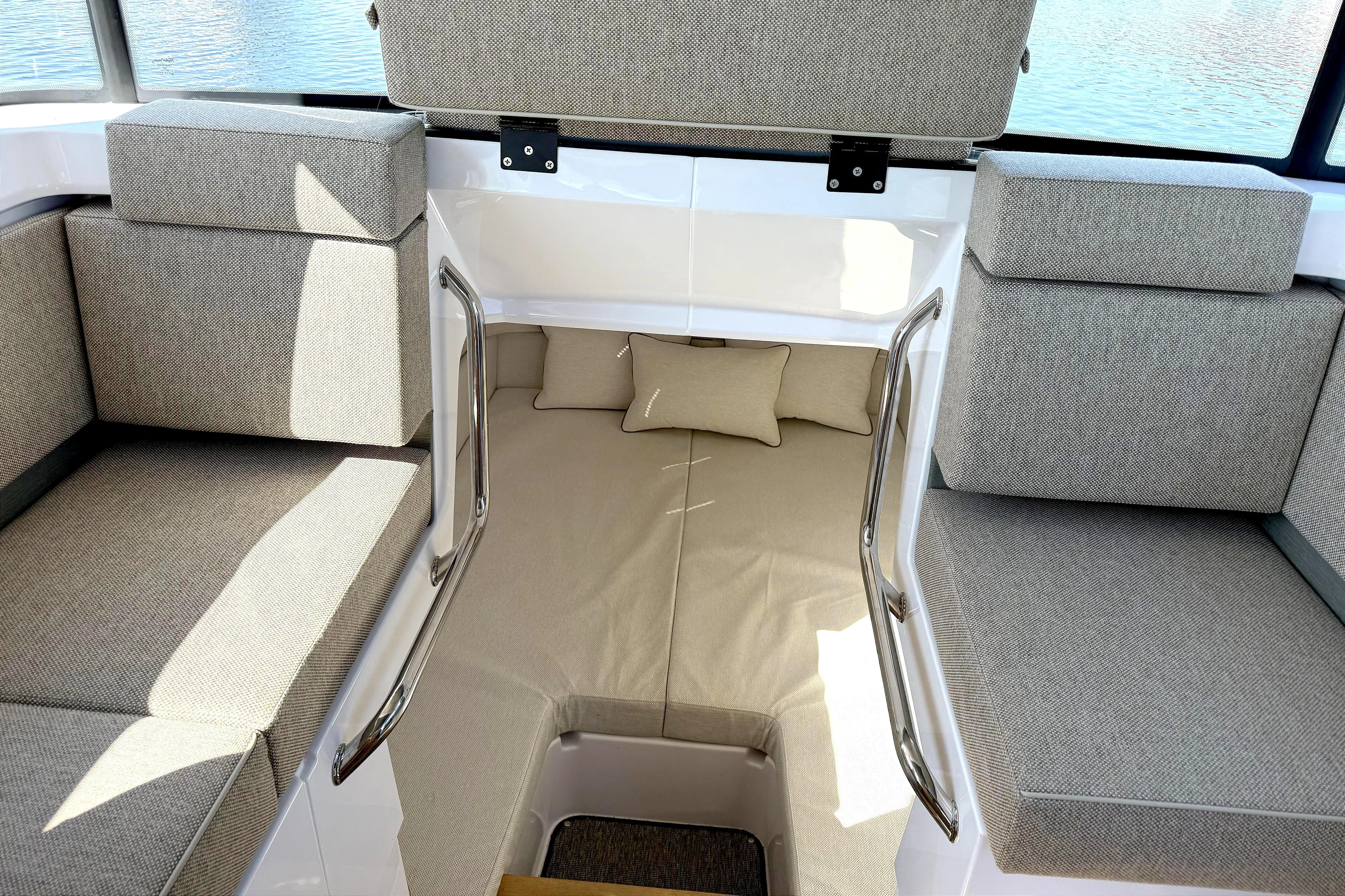  Yacht Photos Pics 2025 Axopar 37 XC CROSS CABIN interior with cushioned seating and cabin bed.