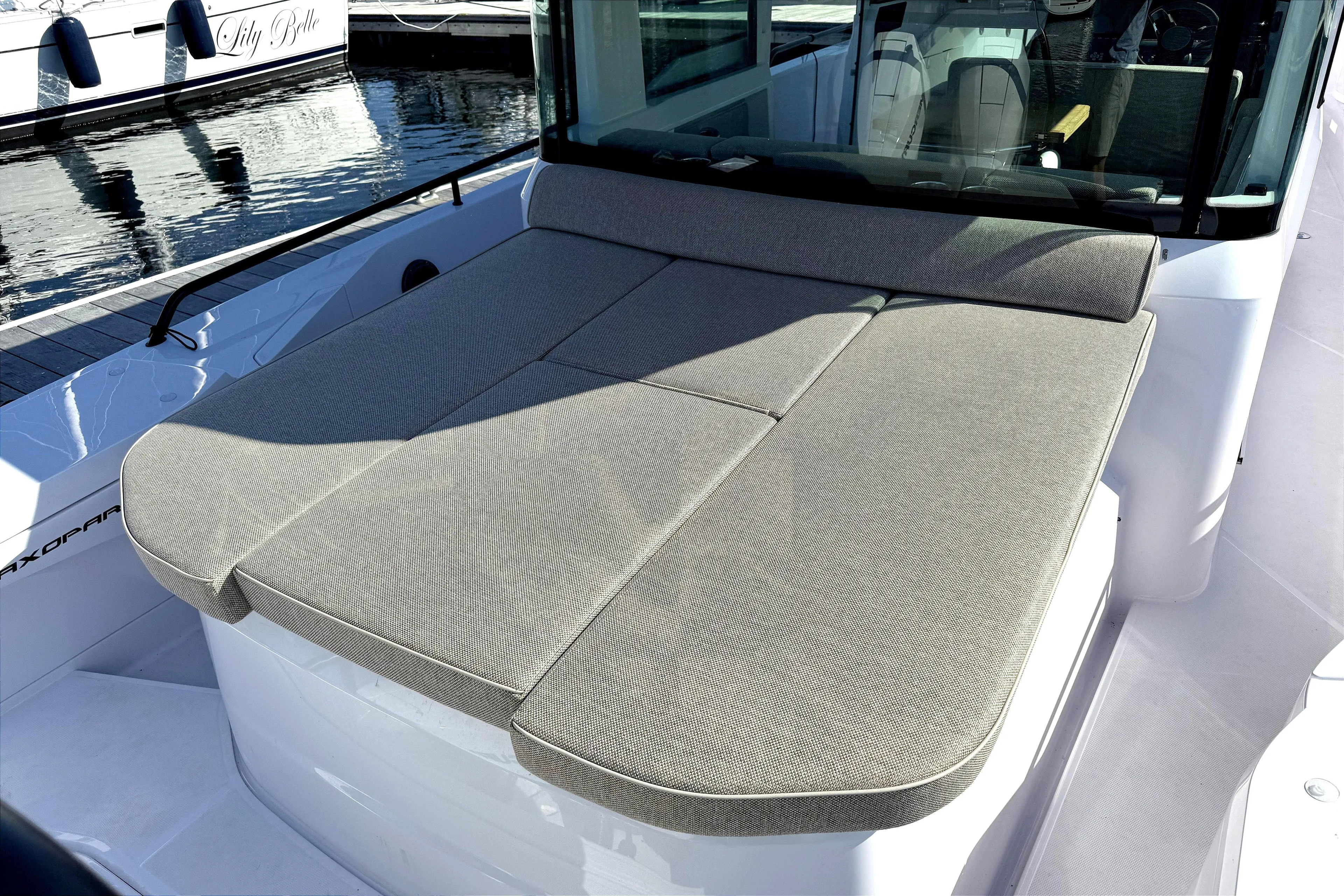  Yacht Photos Pics 2025 Axopar 37 XC CROSS CABIN with cushioned sunbed on deck.