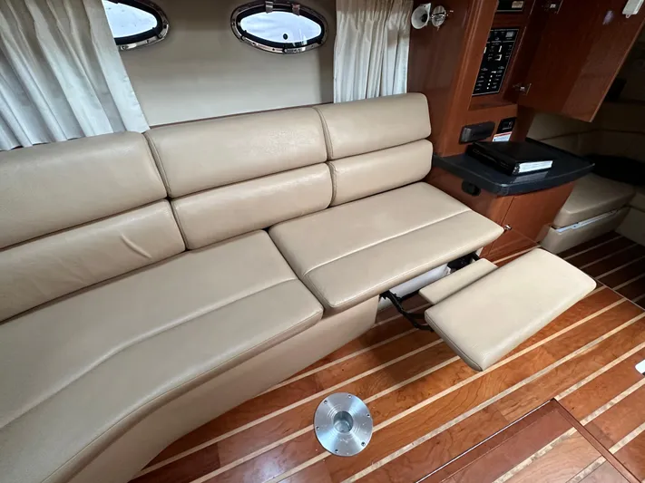 Beautify Yacht Photos Pics Luxurious interior of 2010 Regal 3760 Sportyacht with beige leather seating and wooden flooring.
