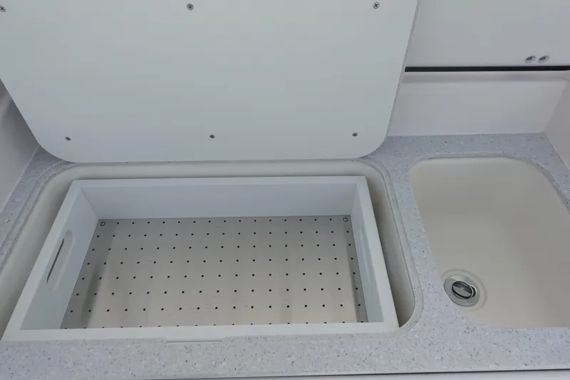  Yacht Photos Pics 2025 Sea Fox 328 Commander boat sink and storage compartment detail.