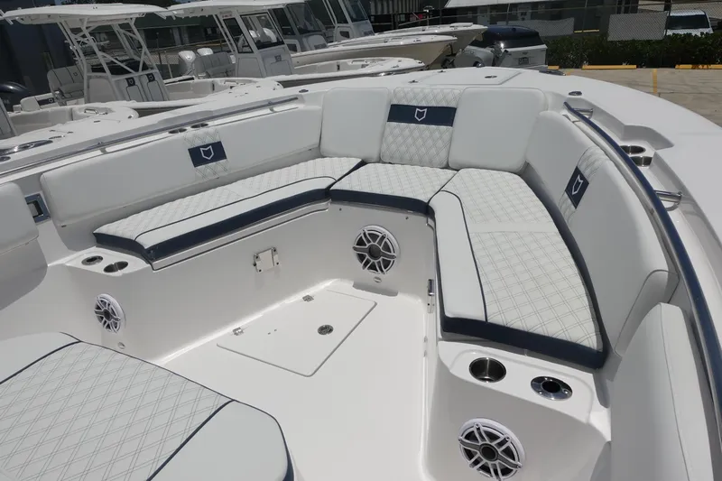  Yacht Photos Pics 2025 Sea Fox 328 Commander boat interior with cushioned seating and built-in speakers.