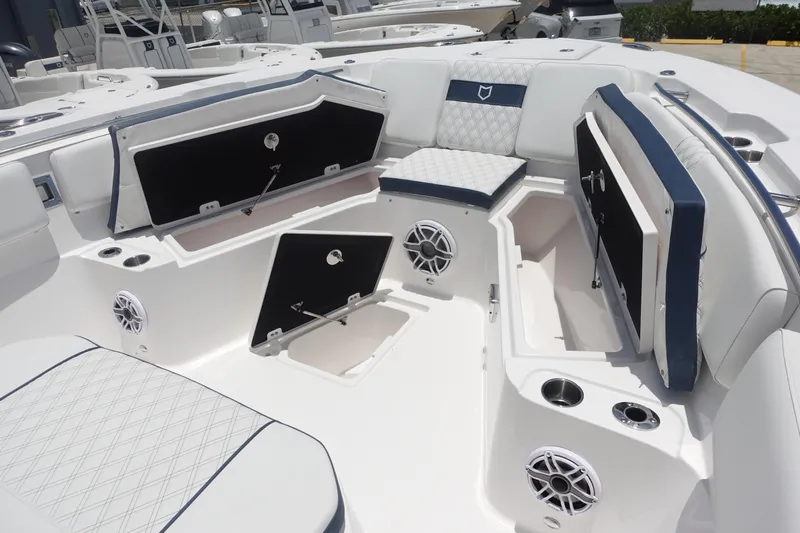  Yacht Photos Pics 2025 Sea Fox 328 Commander boat interior with open storage compartments and seating.