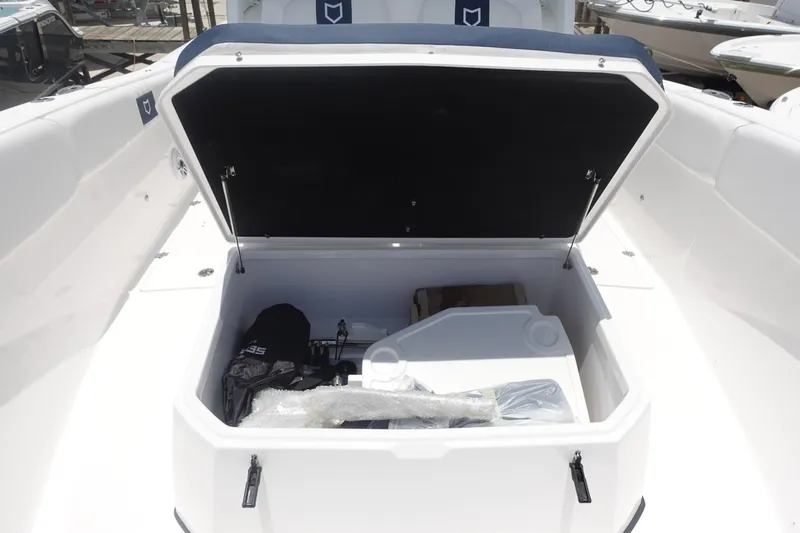  Yacht Photos Pics 2025 Sea Fox 328 Commander boat storage compartment open, showcasing spacious interior.