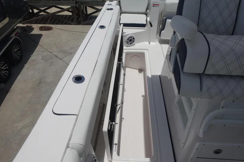  Yacht Photos Pics 2025 Sea Fox 328 Commander boat interior with storage compartment and seating.