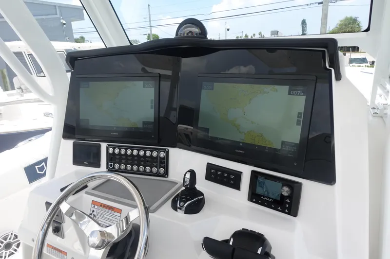  Yacht Photos Pics 2025 Sea Fox 328 Commander dashboard with dual navigation screens and controls.